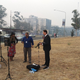 ABC News Australia journalist Dan Bourchier sets up for the nightly broadcast outside of the TV studio in Canberra because the outdoor smoke has caused the building’s fire alarms to go off